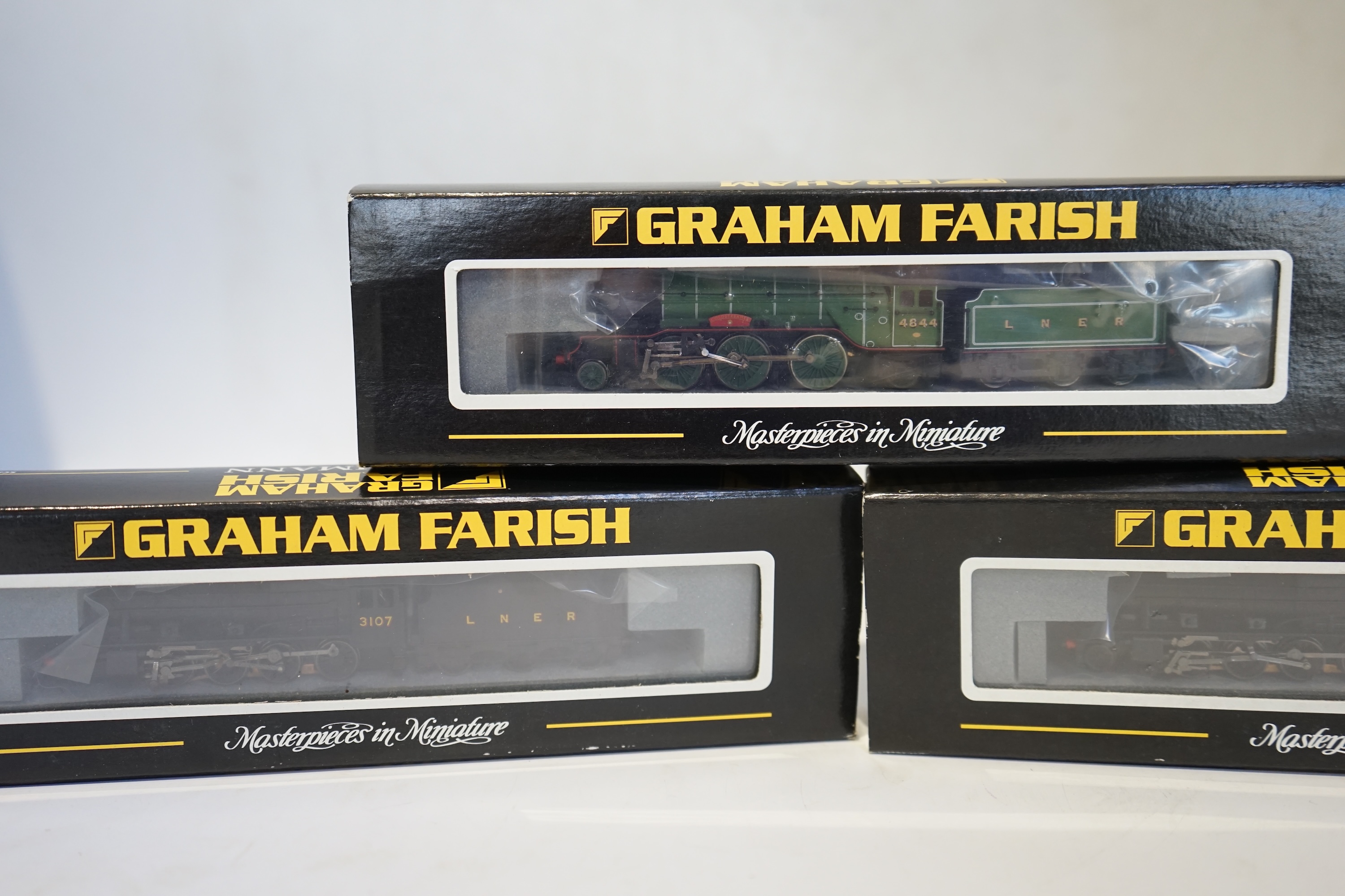 Three boxed Graham Farish N gauge railway LNER tender locomotives; a Class 8F, 3107 (372-150), a Class 8F, 3107 (372-150), and a Class V2, 4844 (372-602). Condition - good.